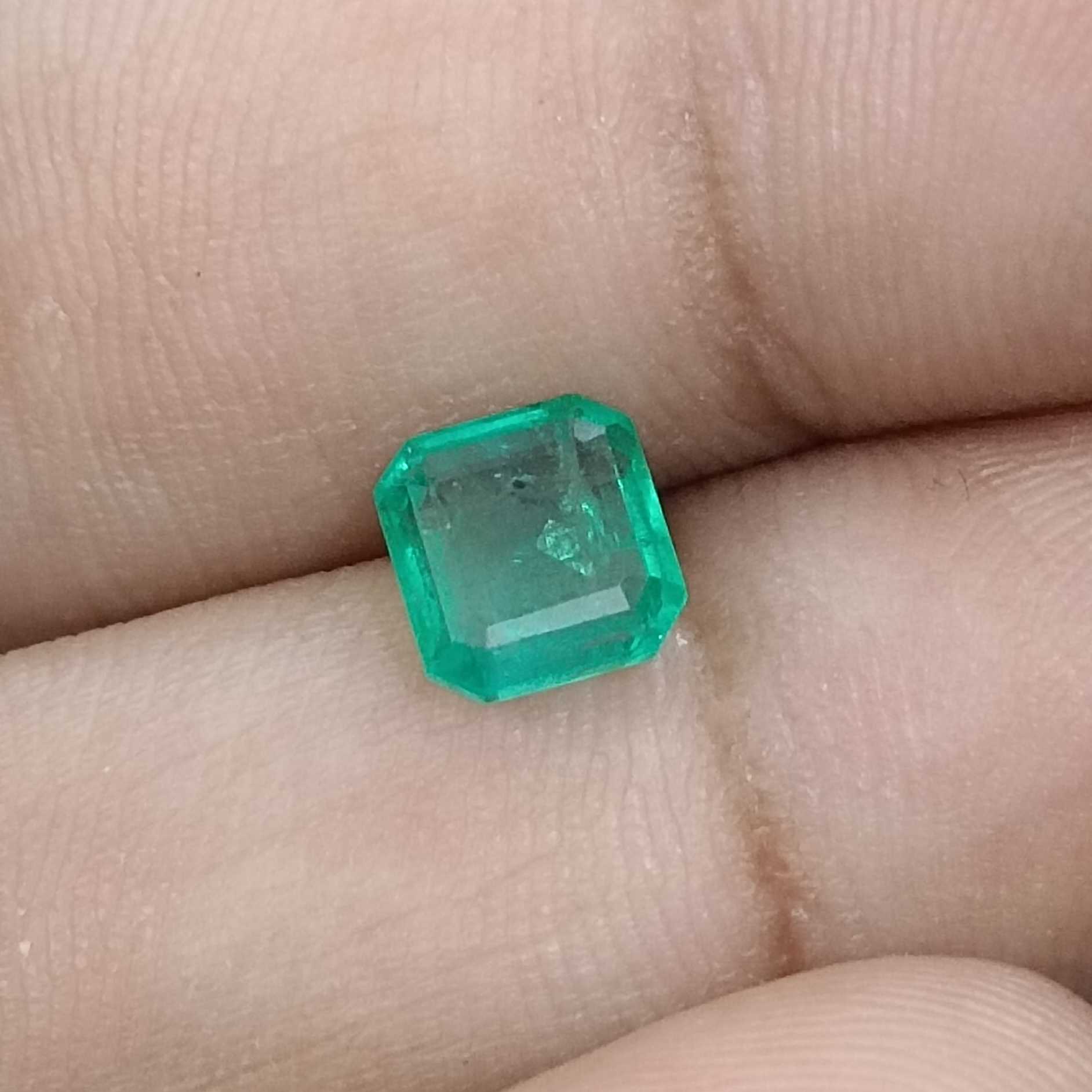 1.31ct deep pure green emerald cut emerald stone