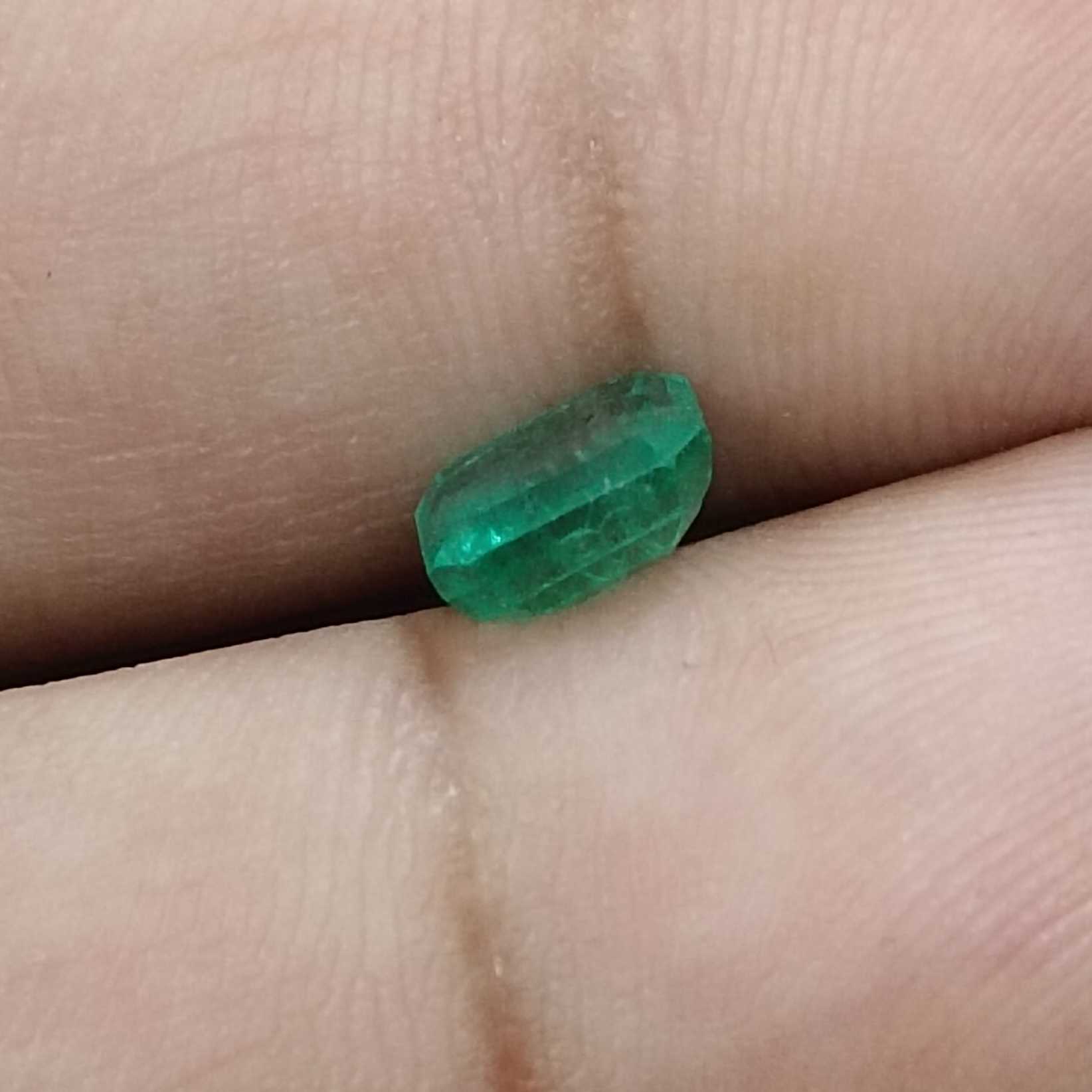 1.31ct deep pure green emerald cut emerald stone