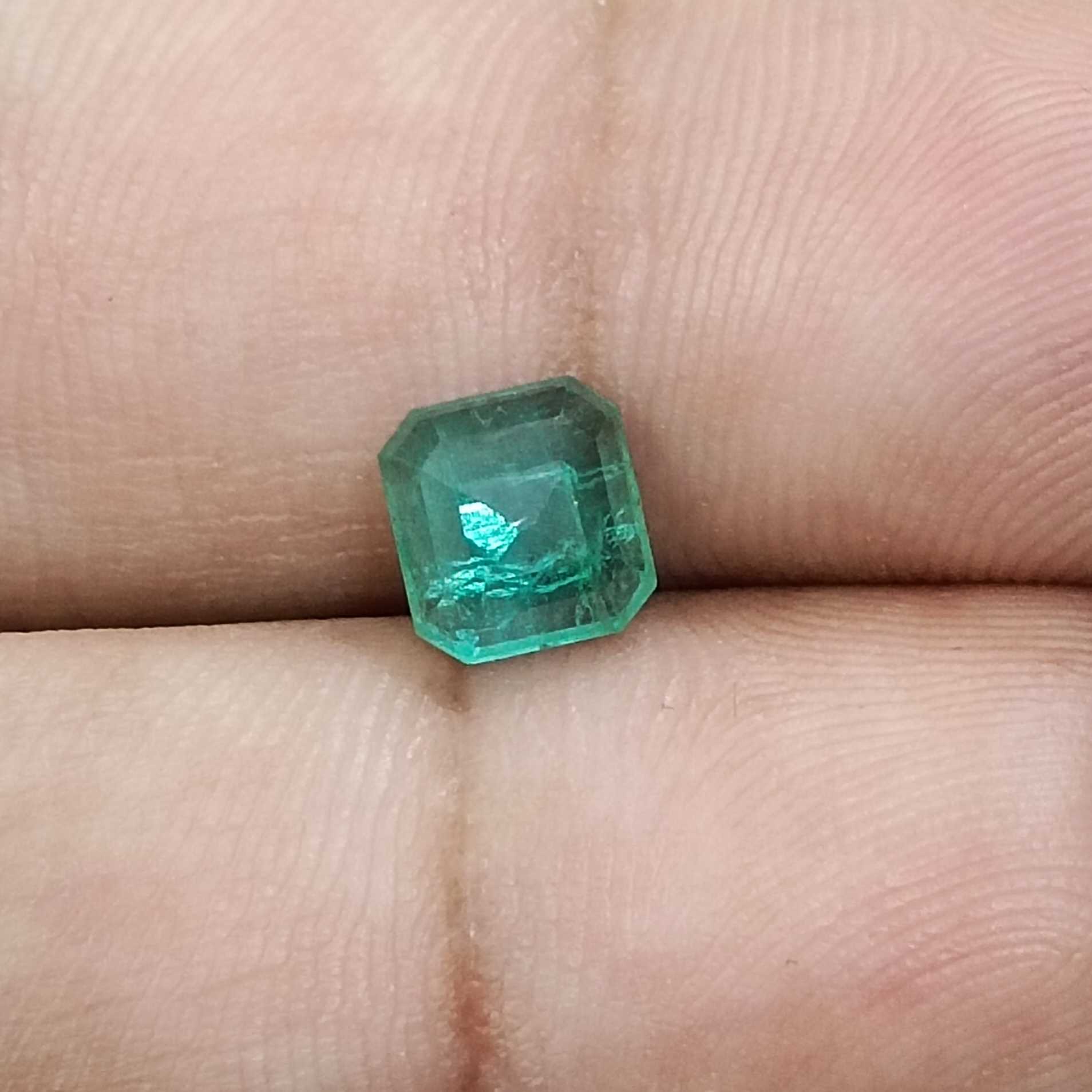 1.31ct deep pure green emerald cut emerald stone