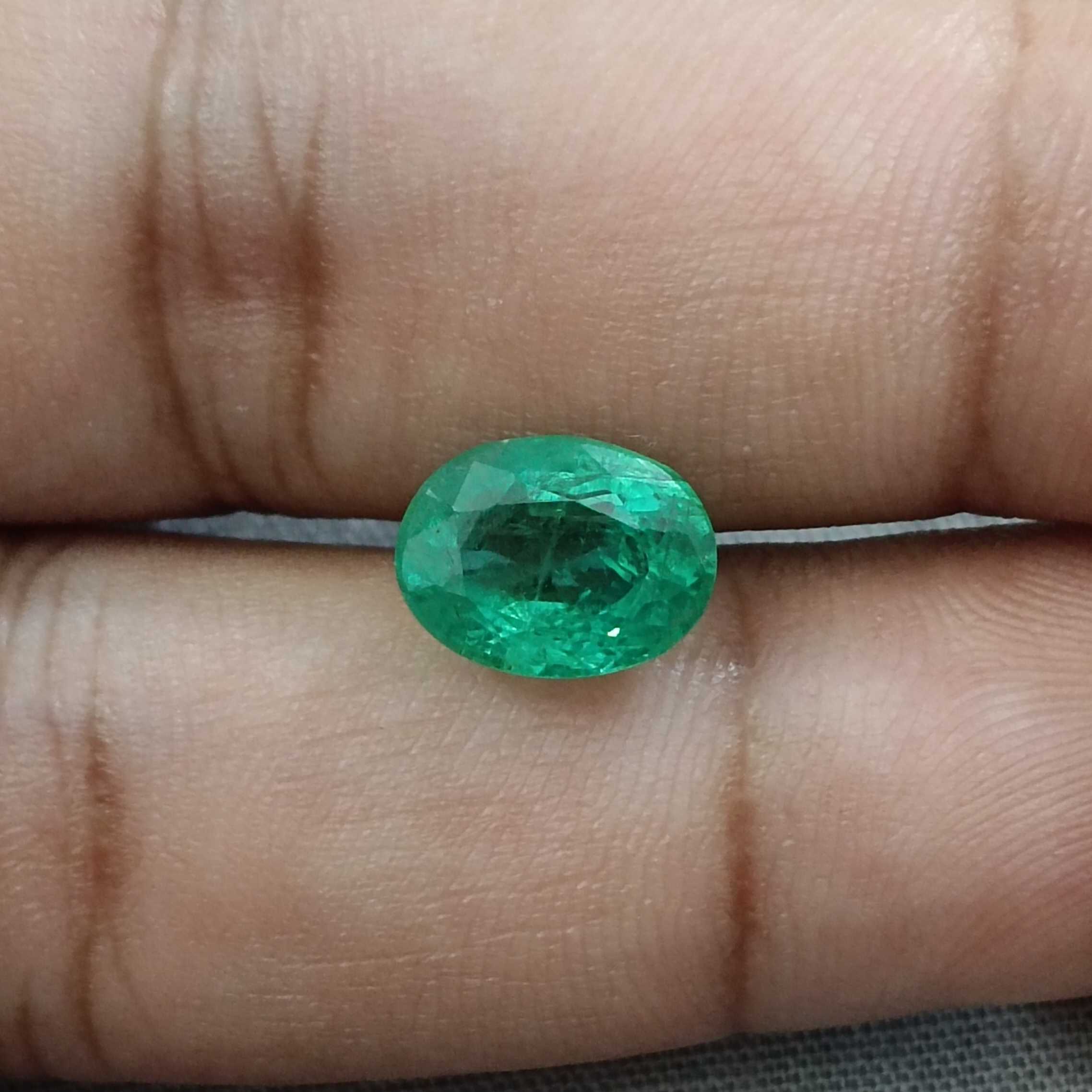 2.81ct bright grape green oval cut emerald 