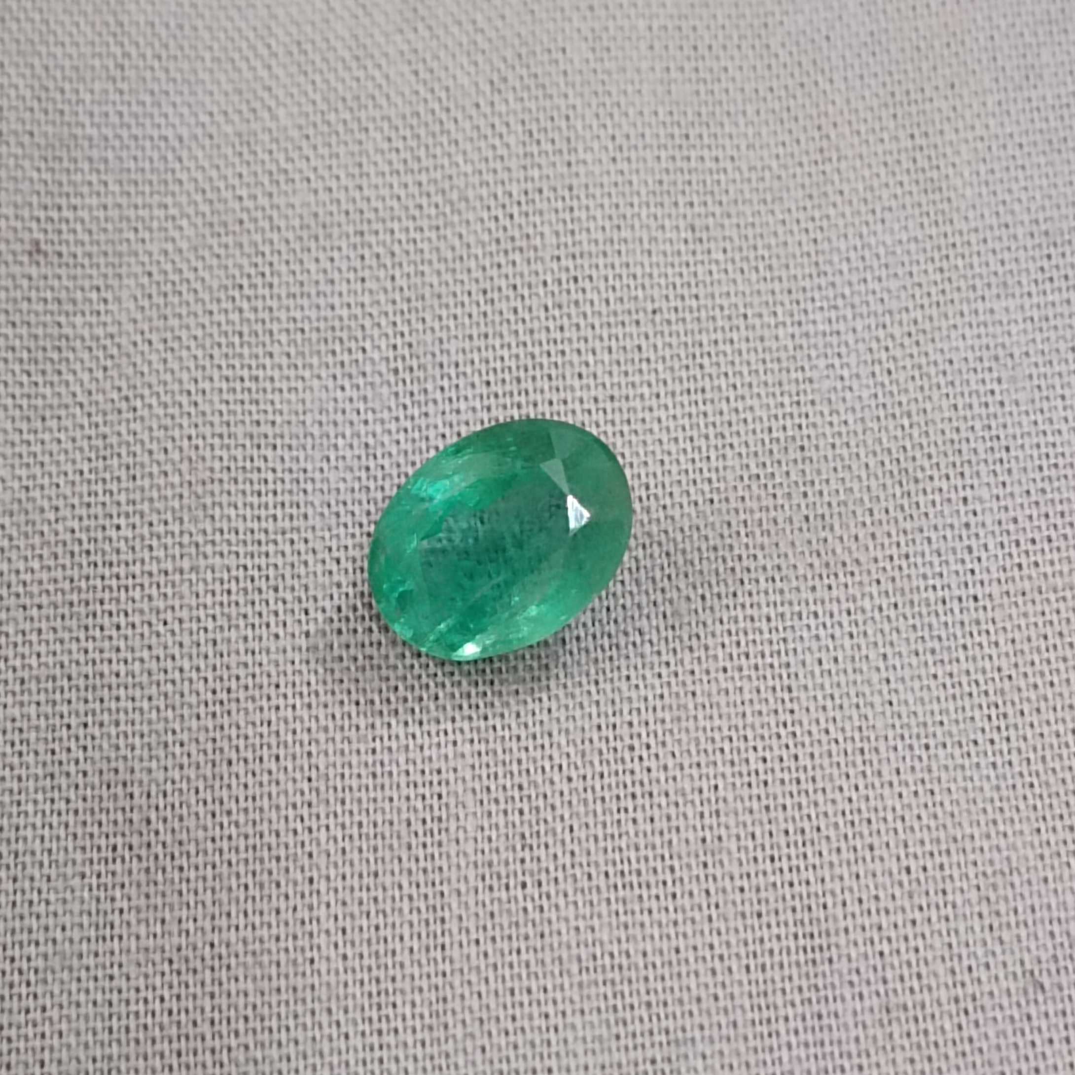 2.81ct bright grape green oval cut emerald 