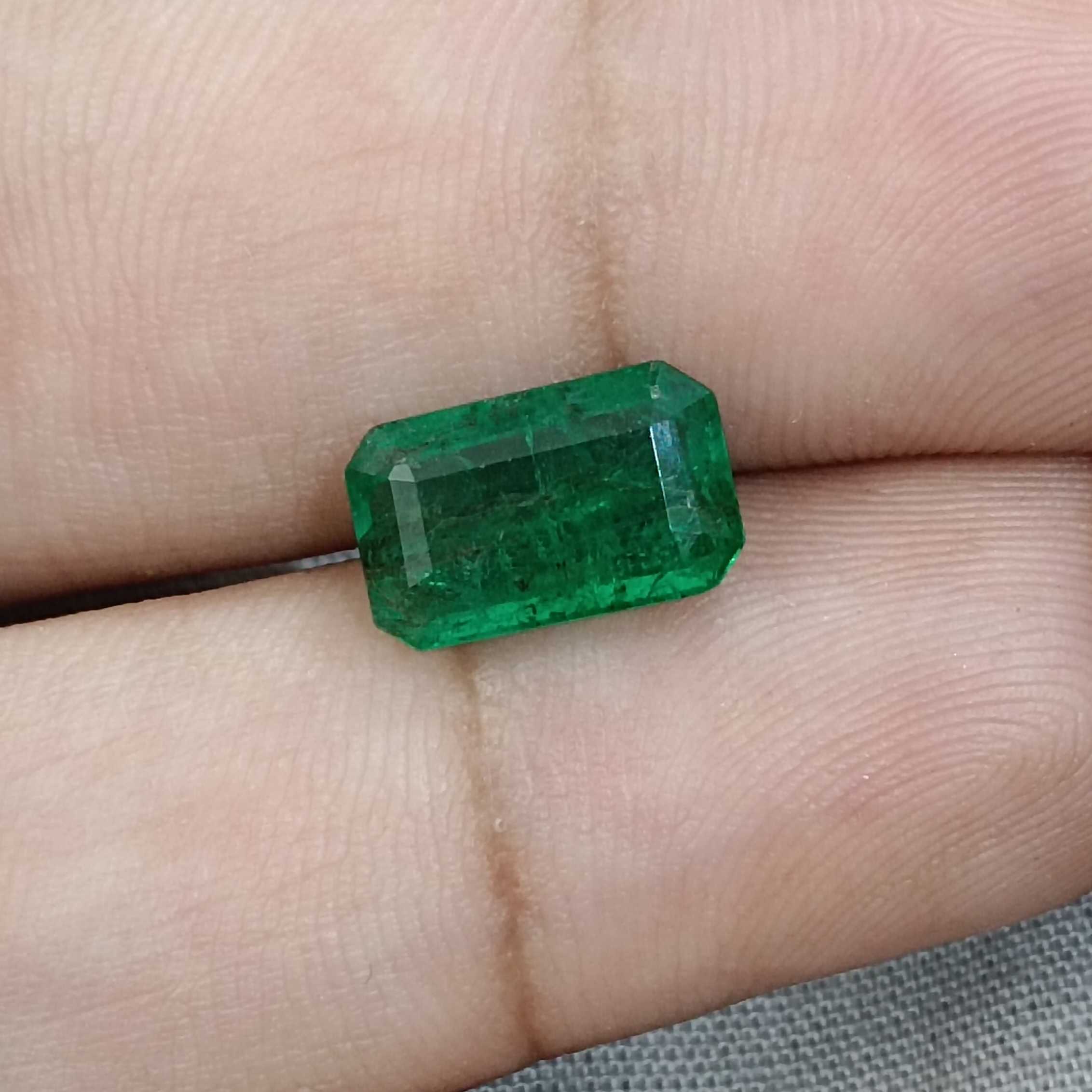 3.55ct deep vivid green octagon emerald gemstone 