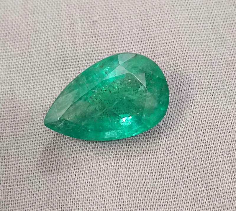 13.47ct bright golden green pear cut emerald gemstone 