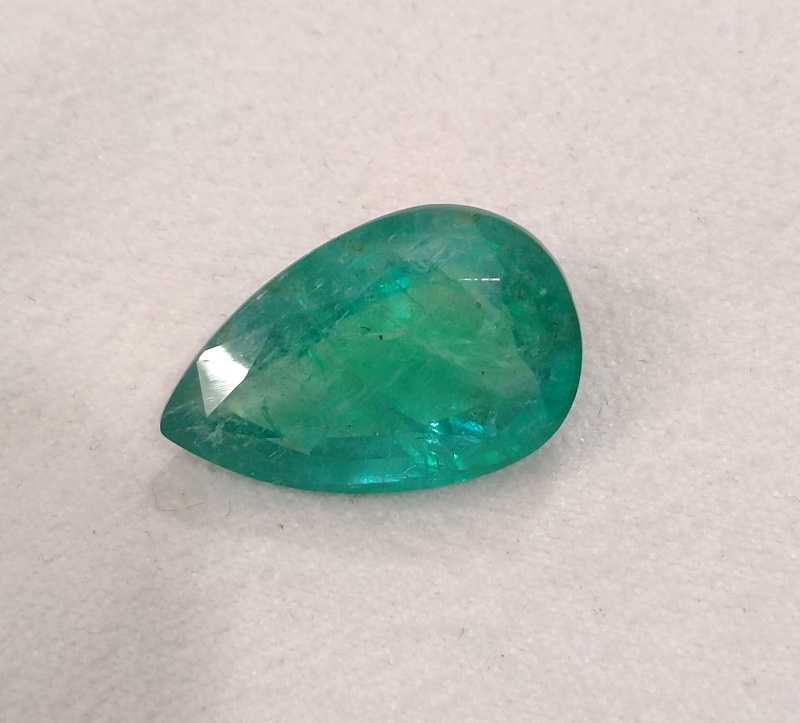 13.47ct bright golden green pear cut emerald gemstone 