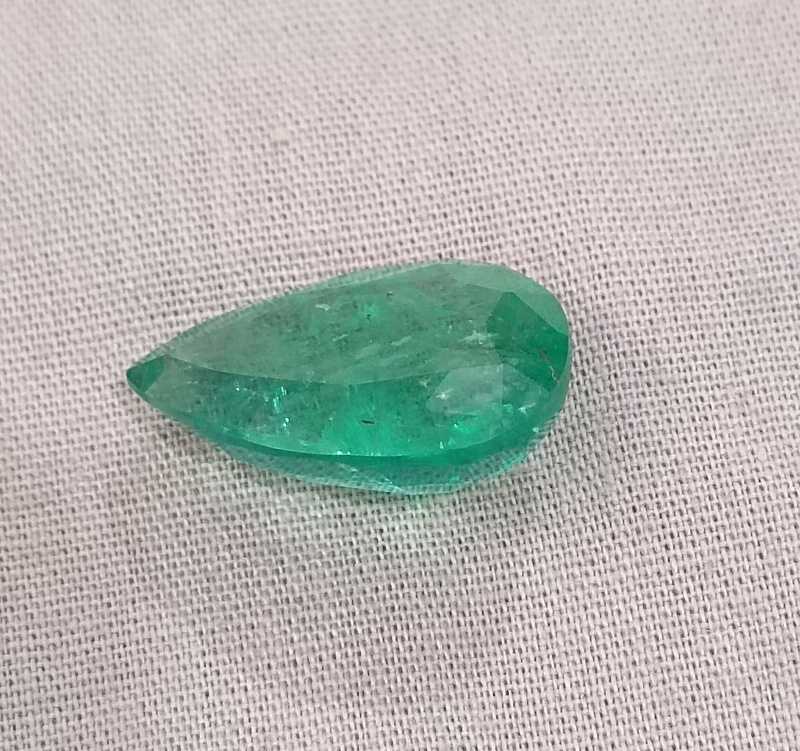 13.47ct bright golden green pear cut emerald gemstone 