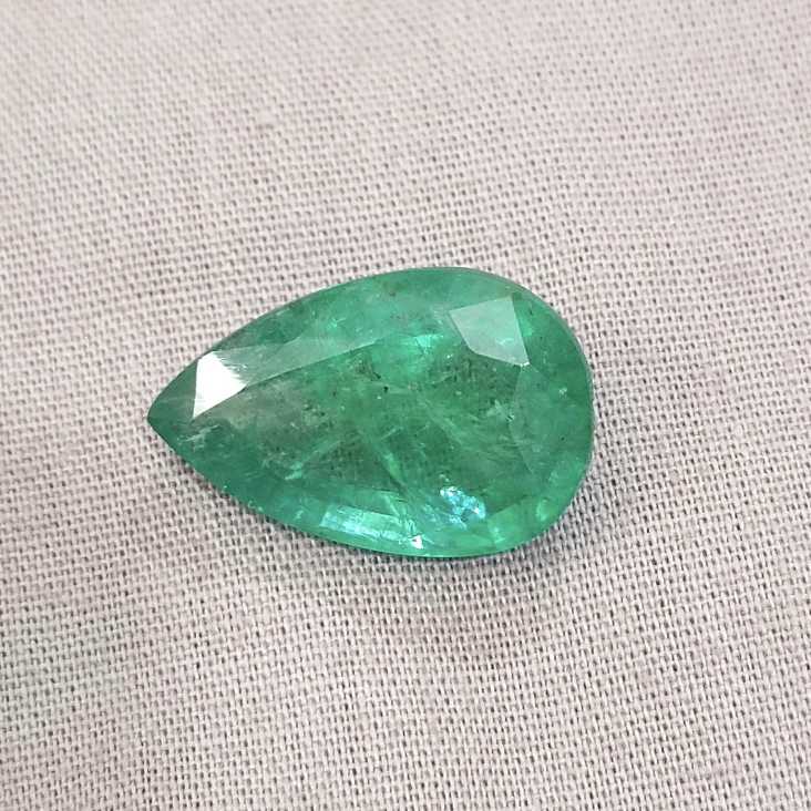 13.47ct bright golden green pear cut emerald gemstone /