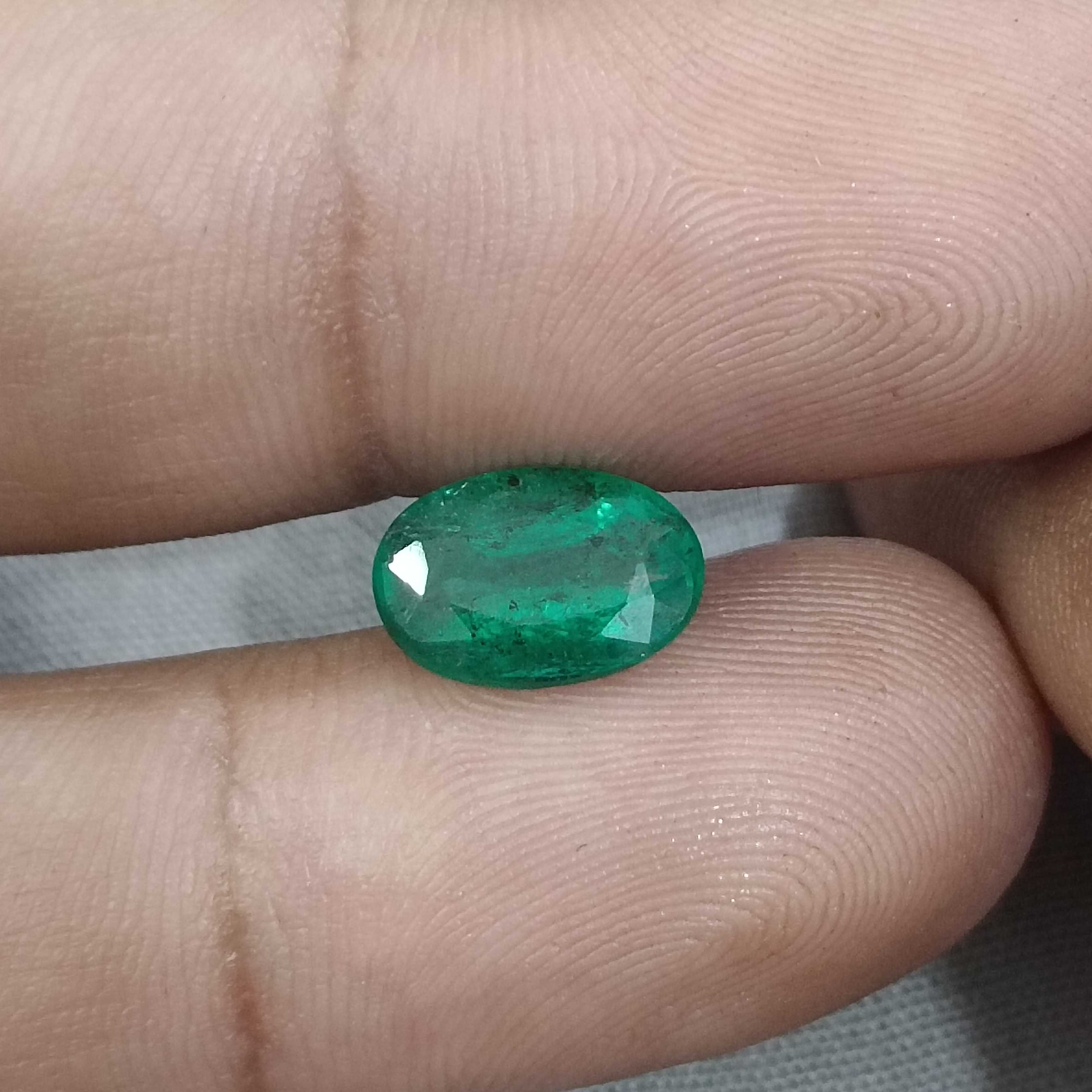 2.40ct vivid golden green oval cut Zambian emerald