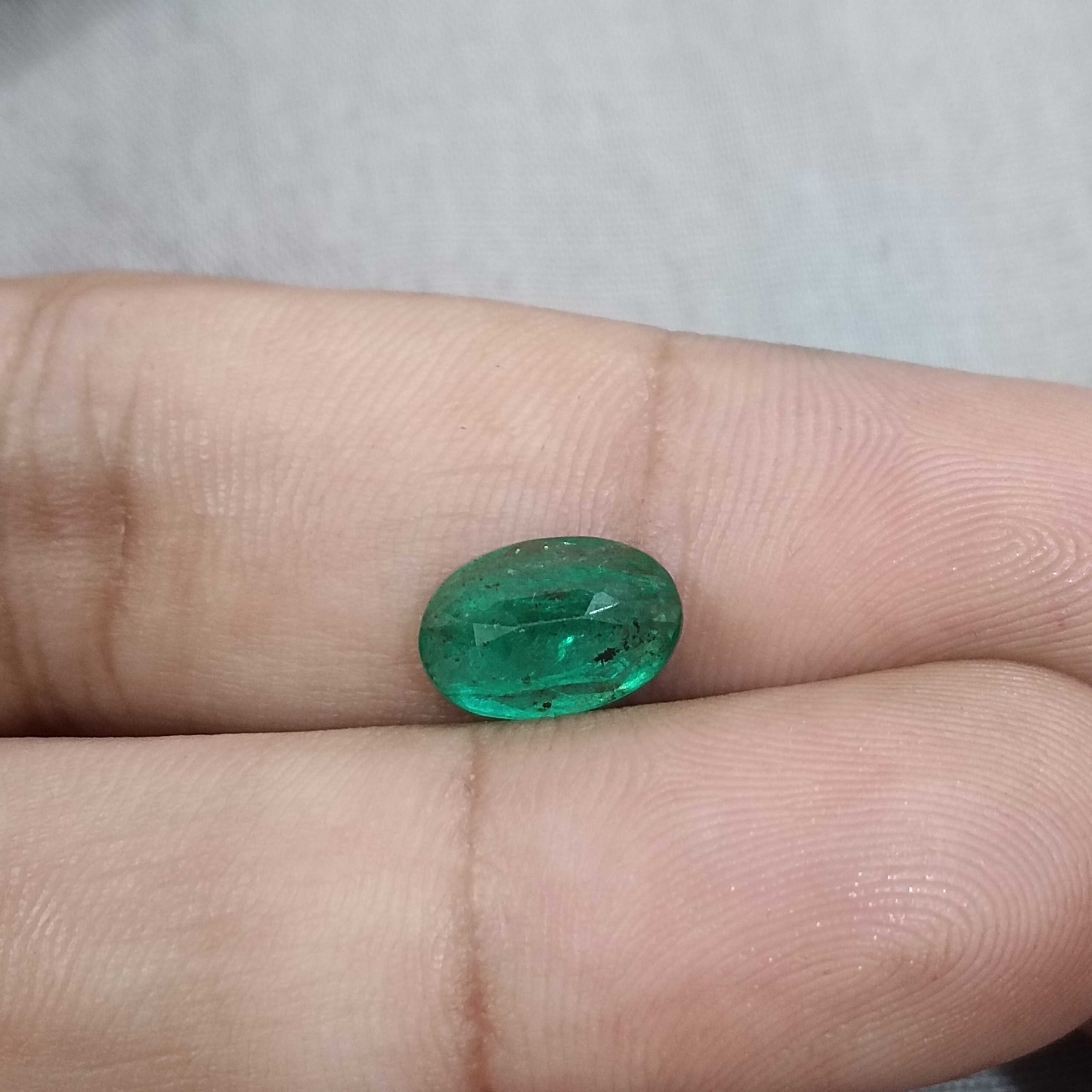 2.40ct vivid golden green oval cut Zambian emerald