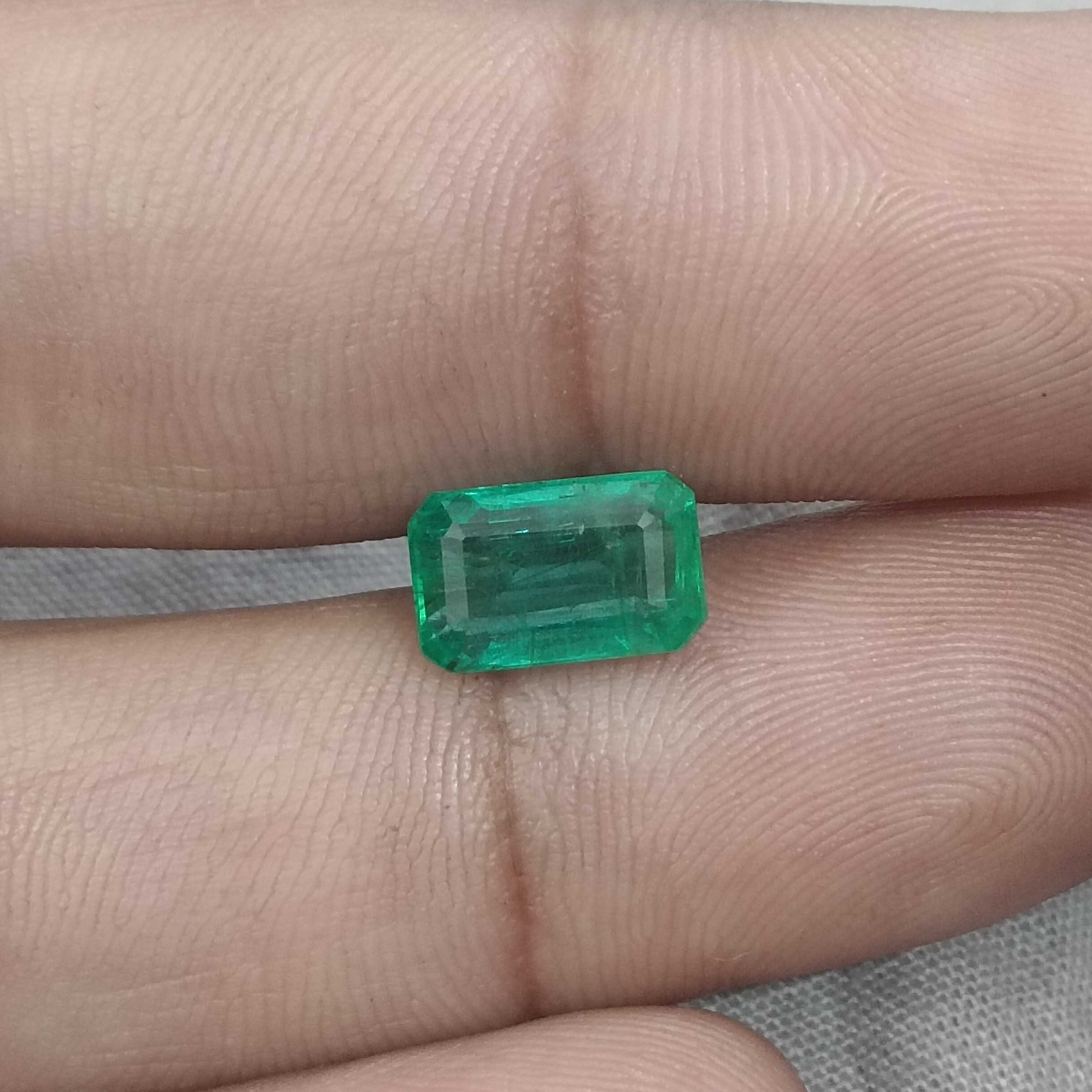 2.74ct certified intense medium green octagon cut emerald gemstone 