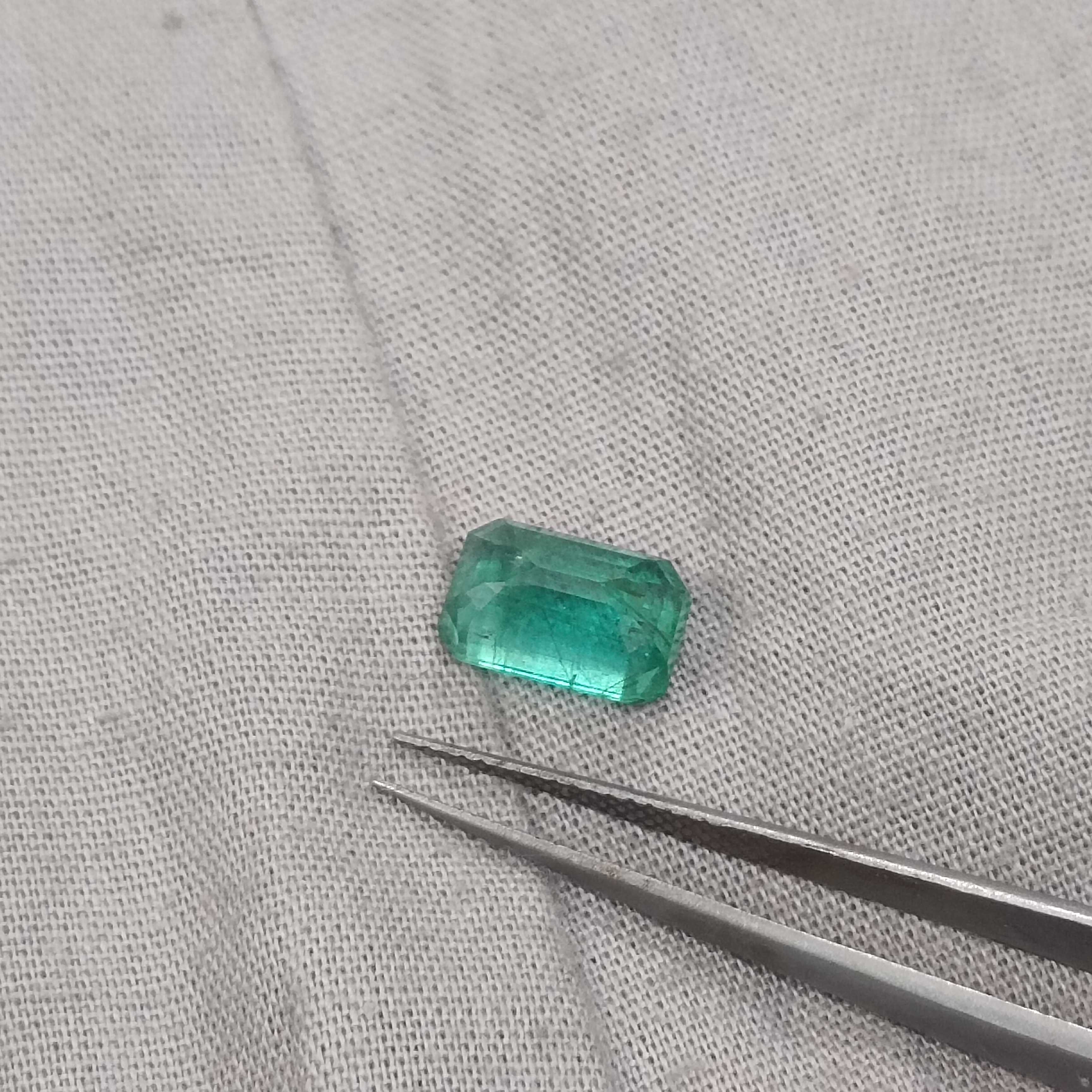 2.74ct certified intense medium green octagon cut emerald gemstone 