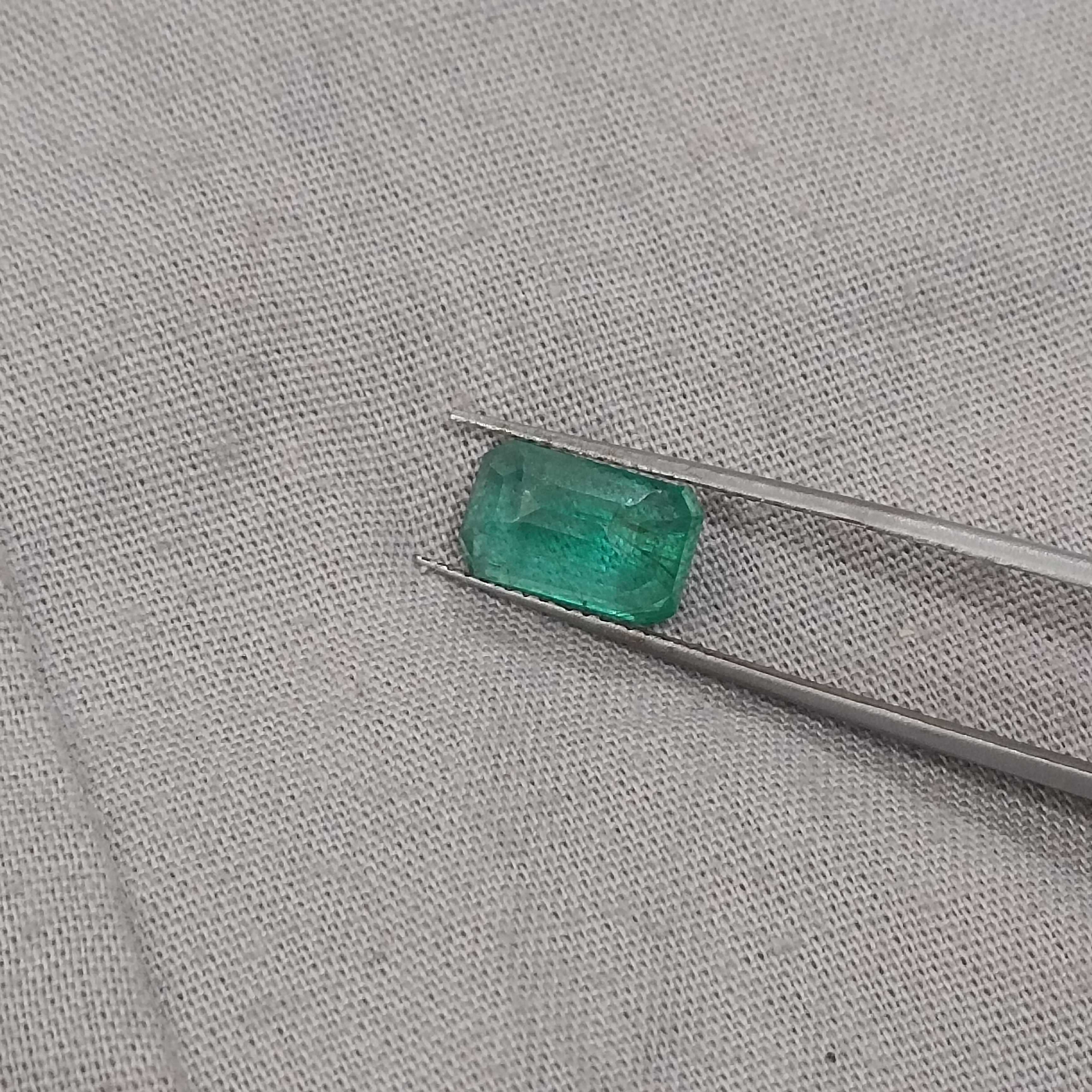 2.74ct certified intense medium green octagon cut emerald gemstone 