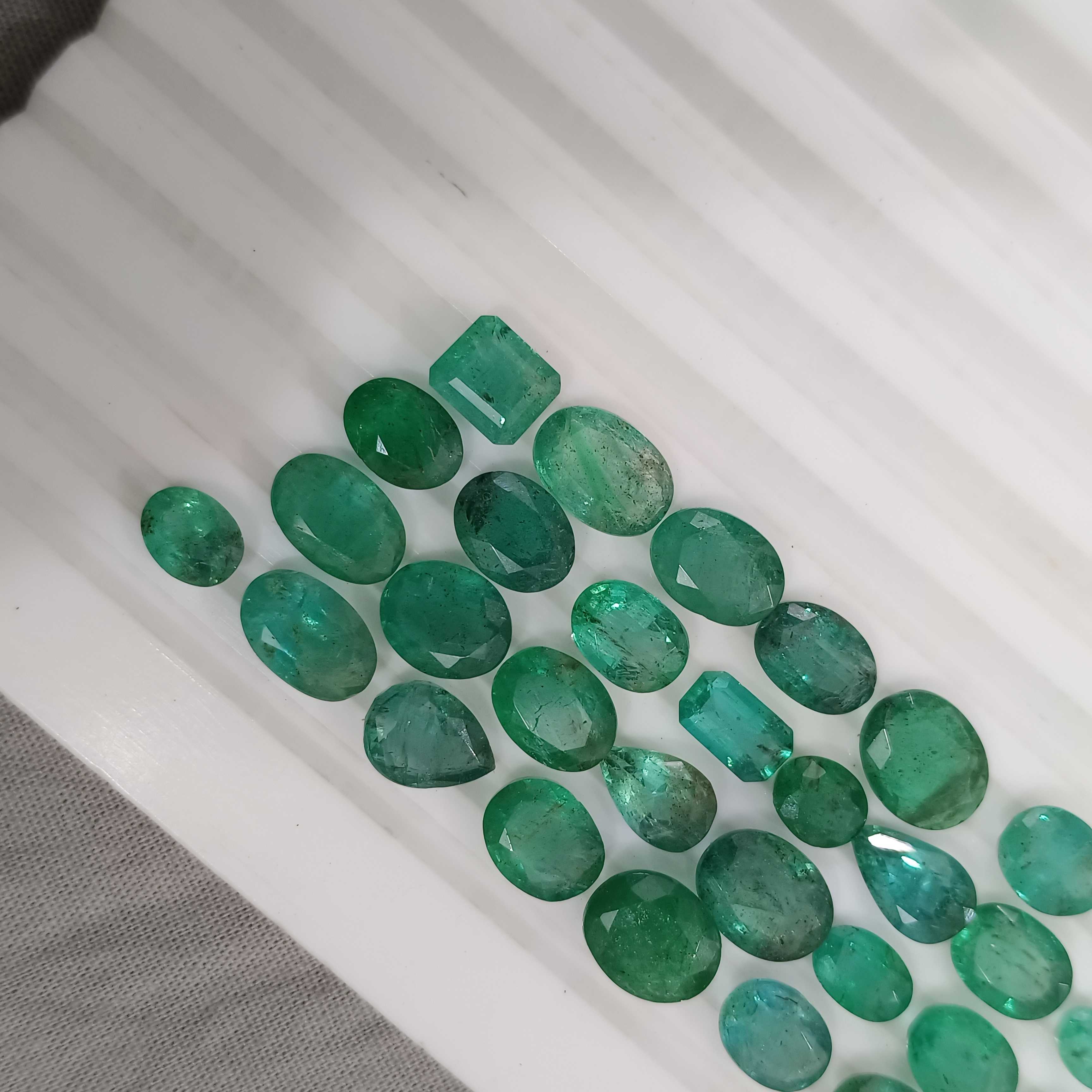 42.5ct medium to deep color multi shape emerald gemstone lot