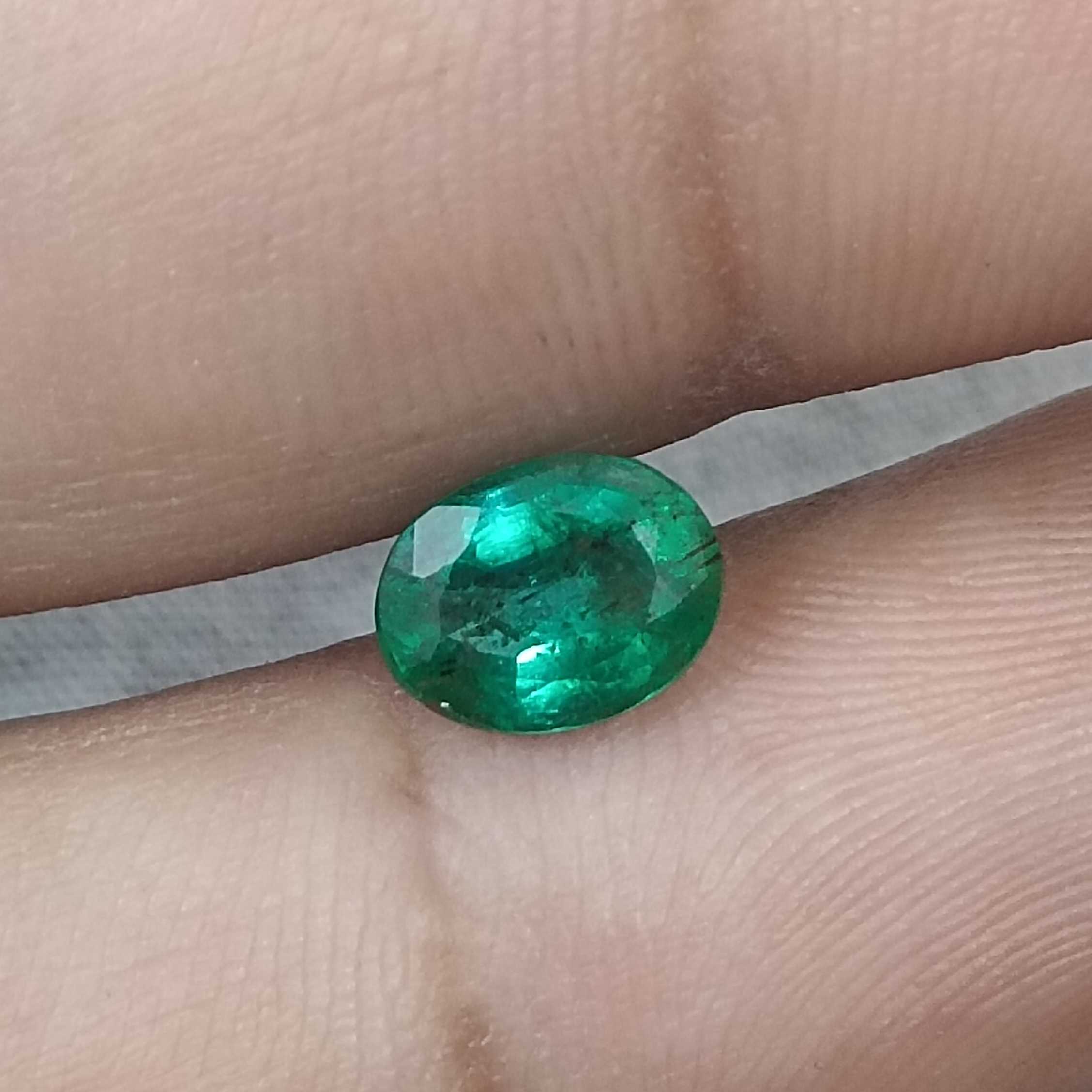 1.26 carat golden green color oval cut Zambian emerald stone 