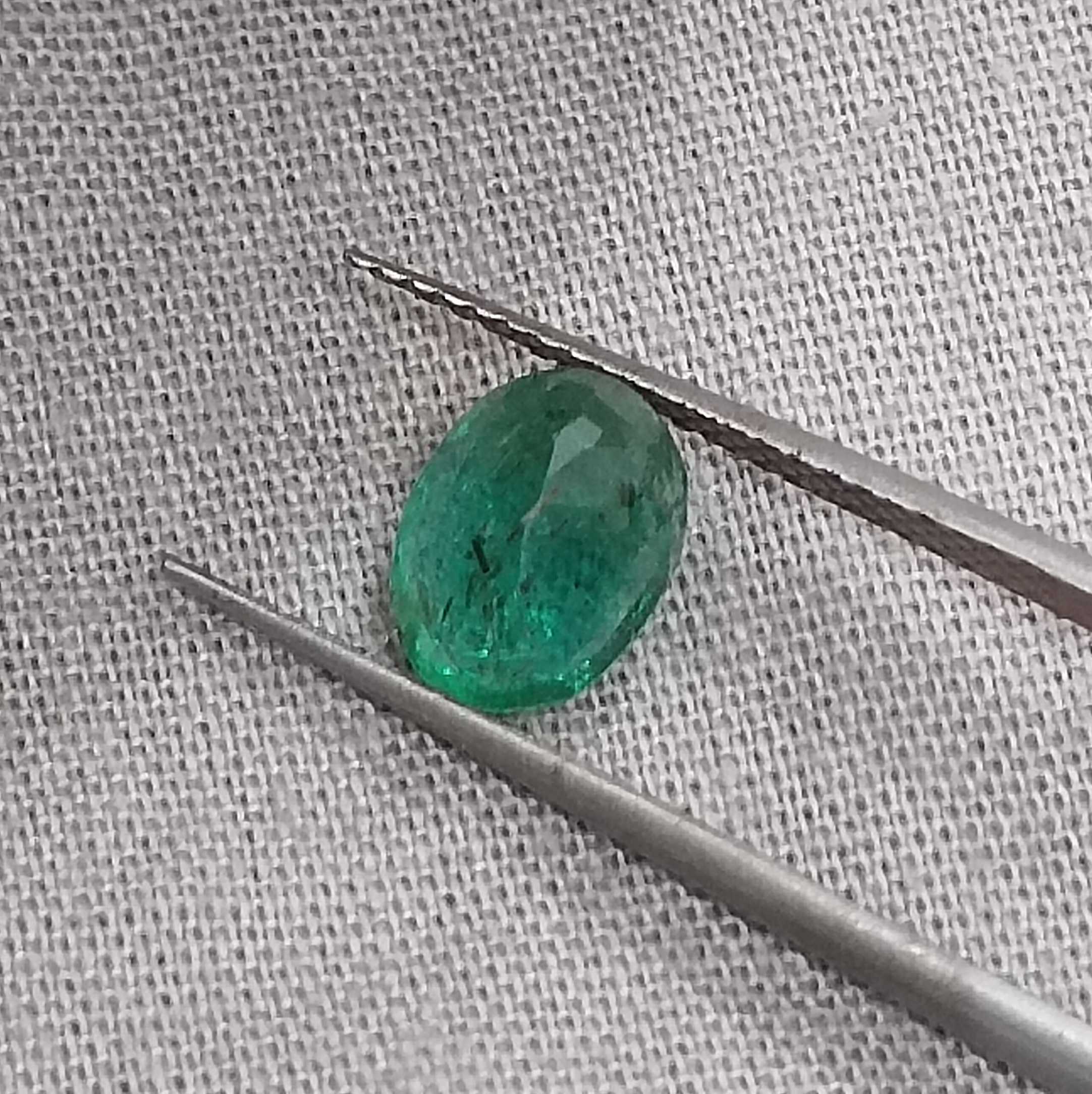 1.26 carat golden green color oval cut Zambian emerald stone 
