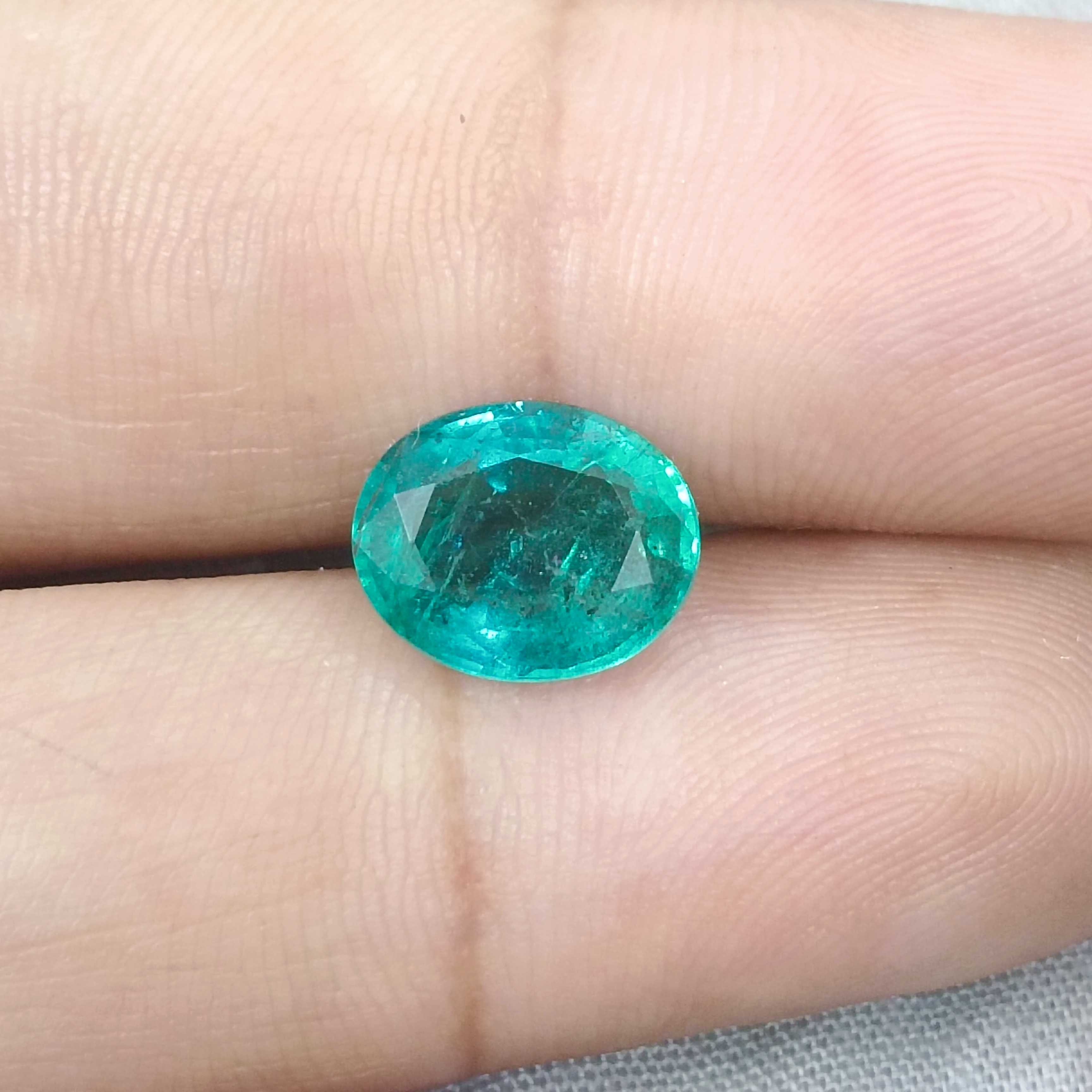 2.93cts certified bluish medium green oval cut emerald 