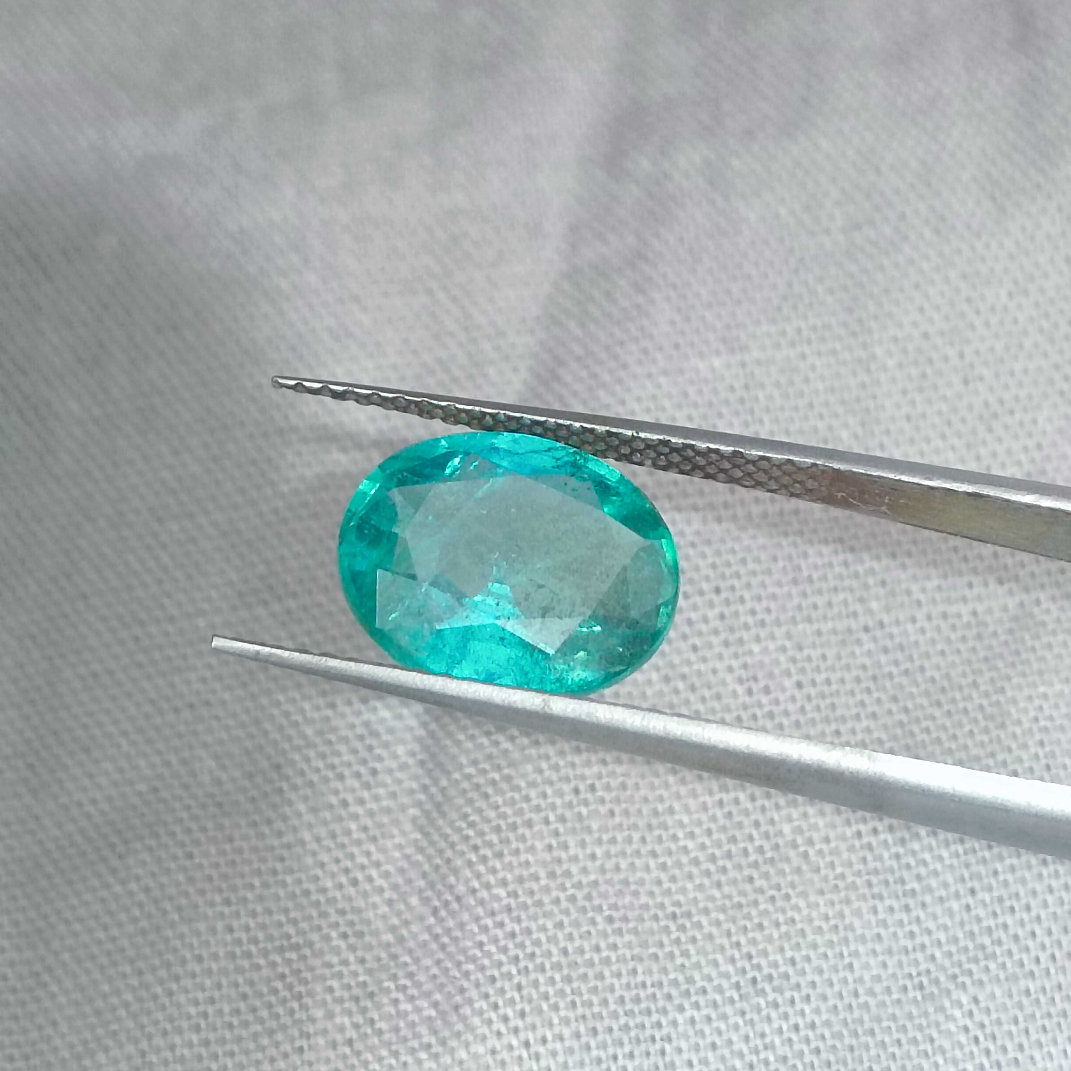 2.93cts certified bluish medium green oval cut emerald 