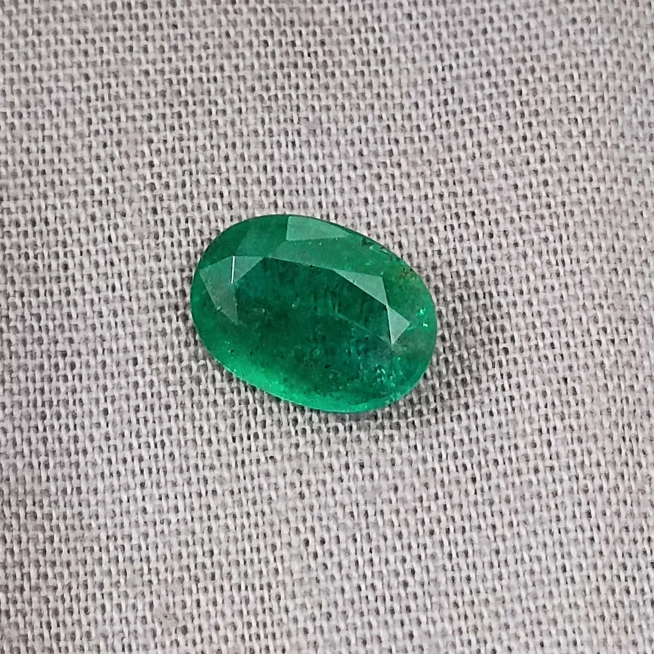 1.69cts GSI certified deep golden green oval cut Zambian emerald gemstone 