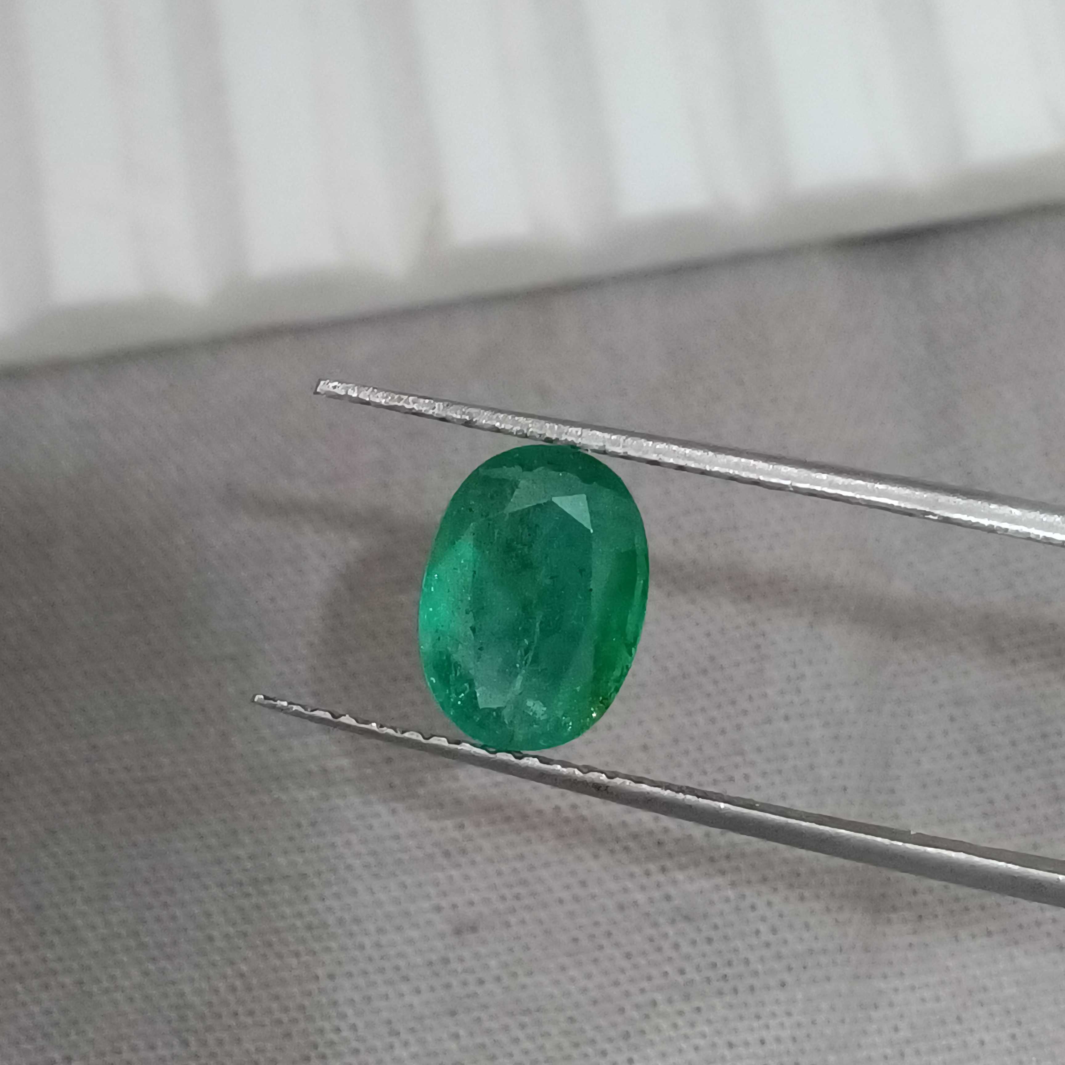 1.69cts GSI certified deep golden green oval cut Zambian emerald gemstone 