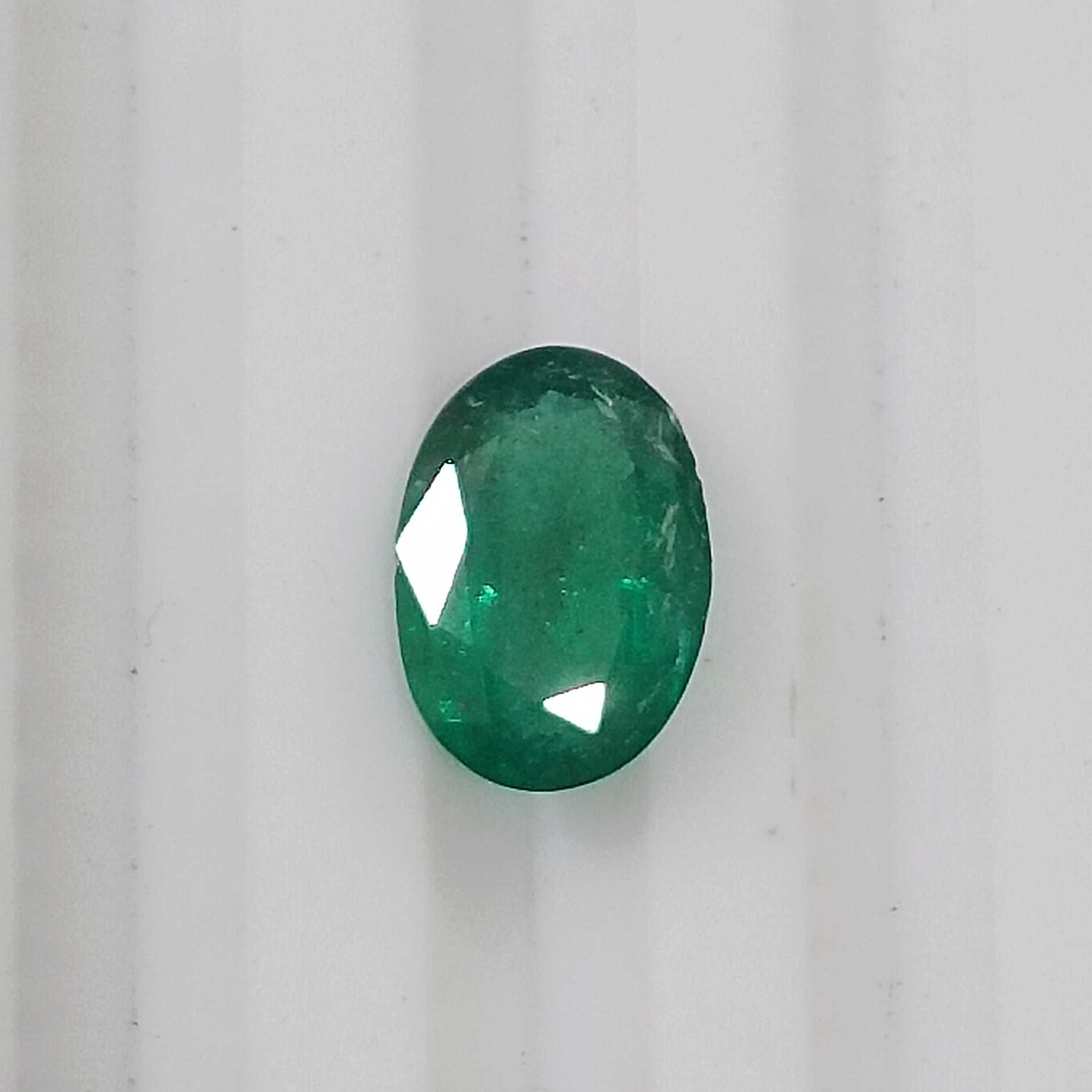 1.05cts GSI certified deep golden green oval cut Zambian emerald 