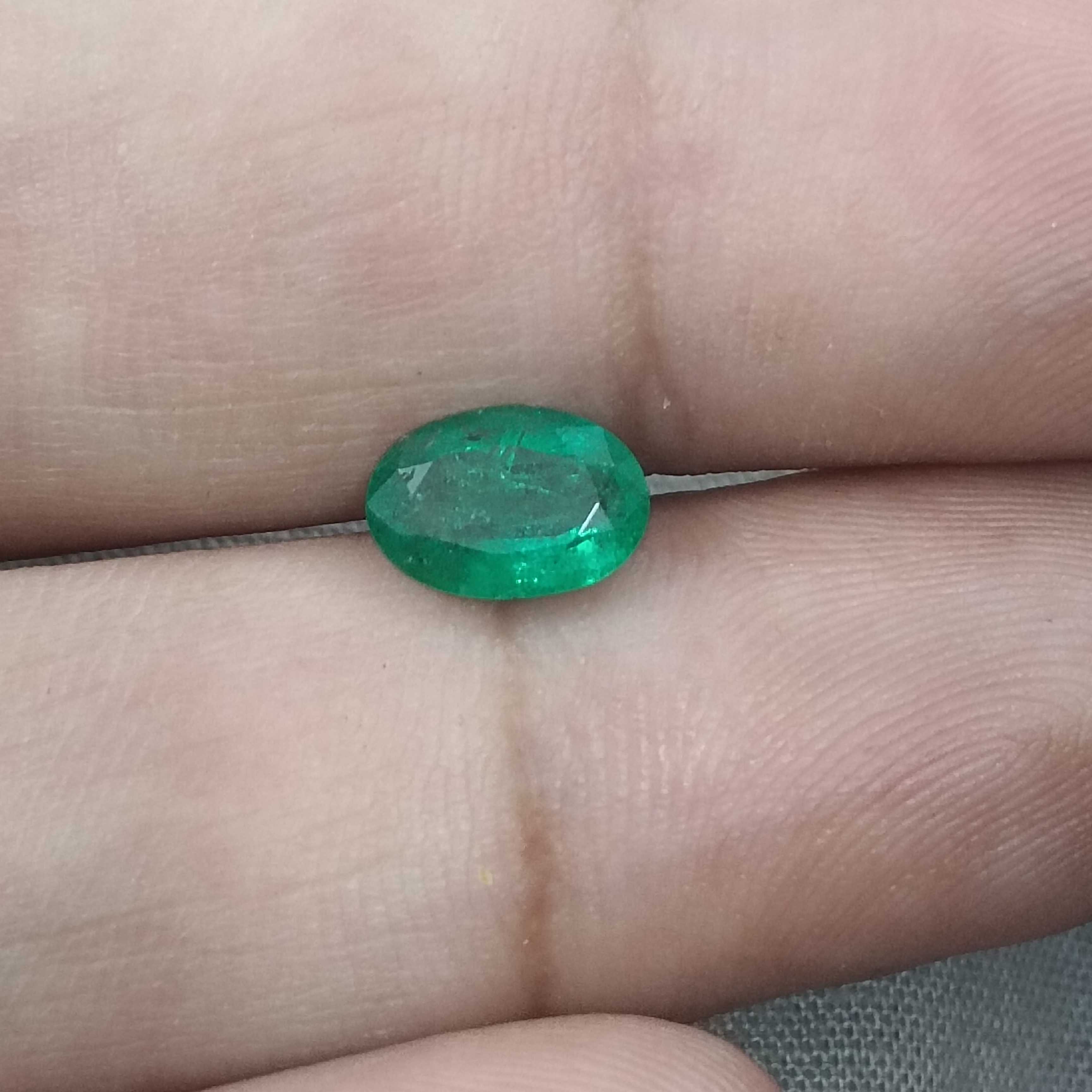 1.05cts GSI certified deep golden green oval cut Zambian emerald 