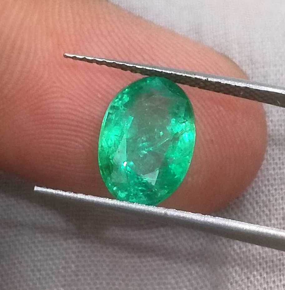 2.57ct GSI certified neon green oval cut Zambian emerald 
