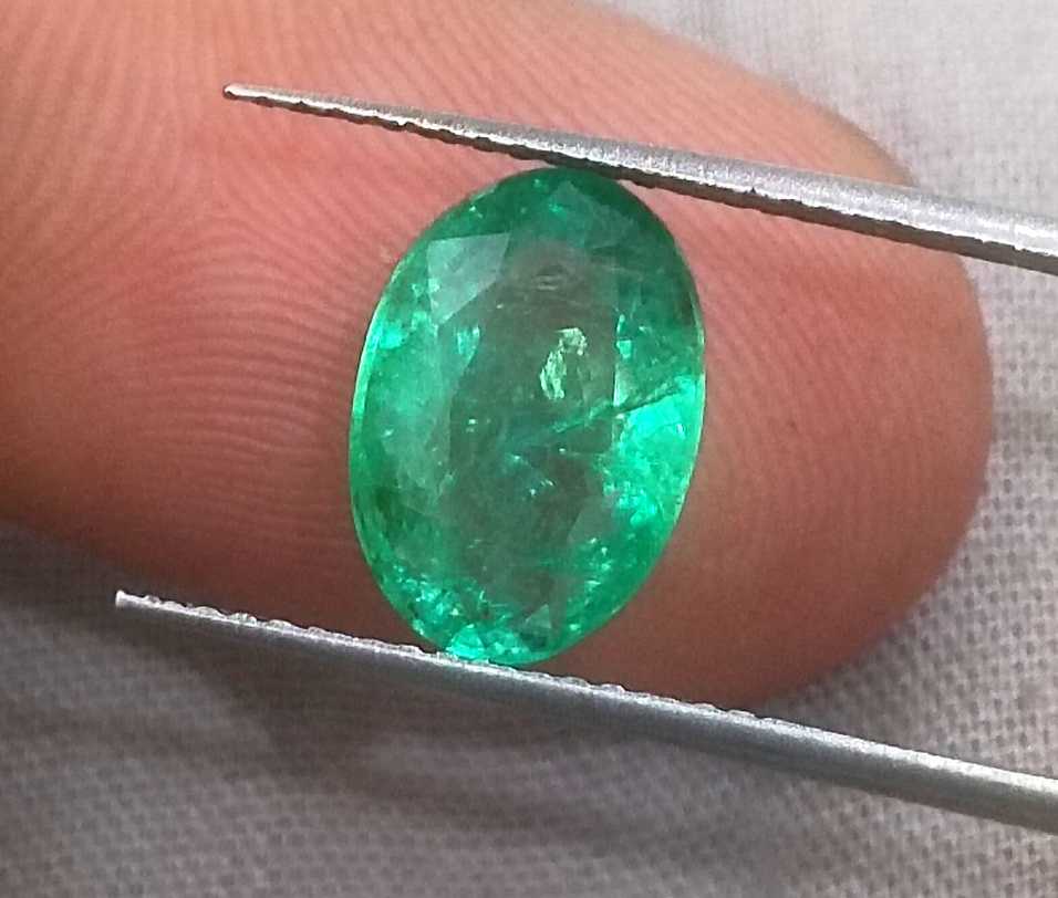 2.57ct GSI certified neon green oval cut Zambian emerald 
