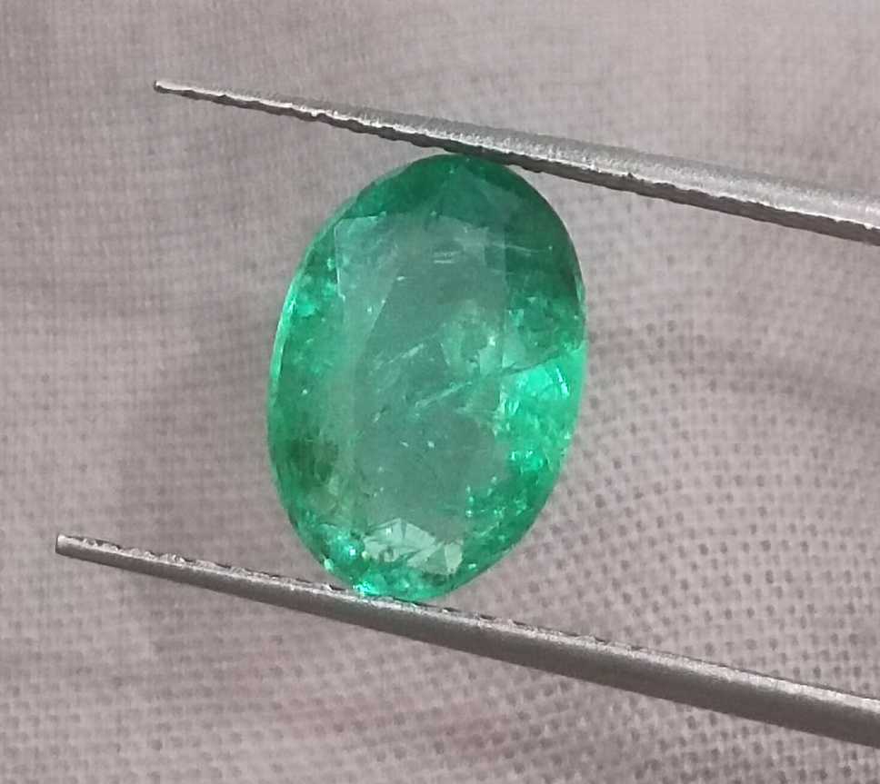 2.57ct GSI certified neon green oval cut Zambian emerald 