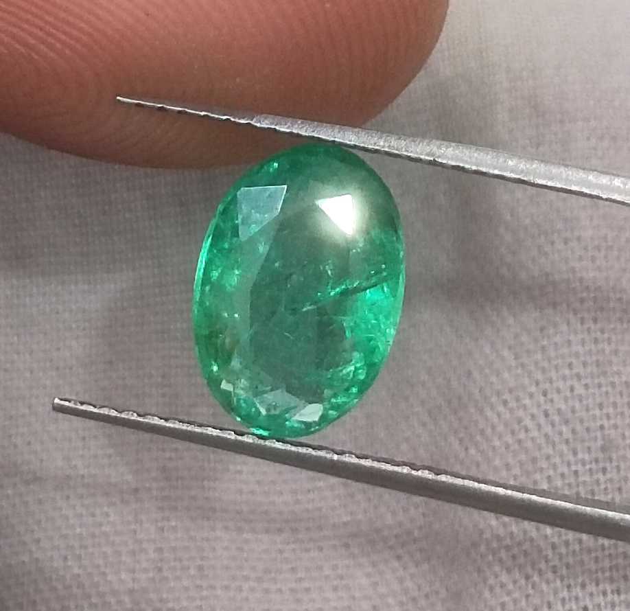 2.57ct GSI certified neon green oval cut Zambian emerald 