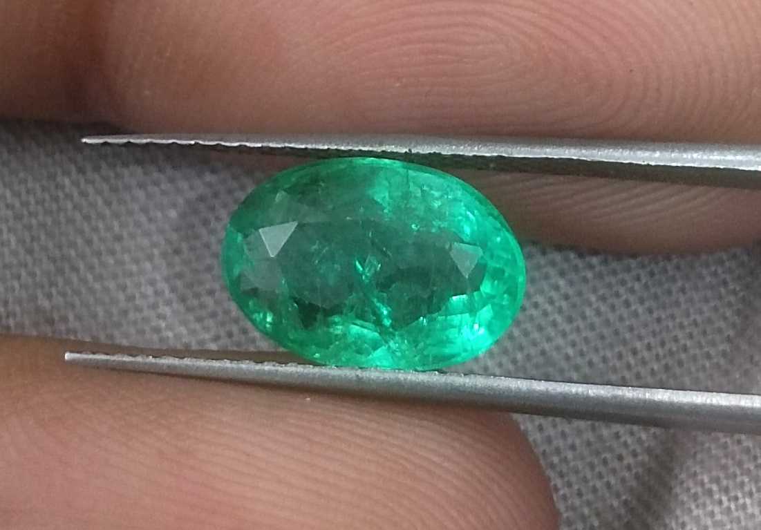 2.57ct GSI certified neon green oval cut Zambian emerald 