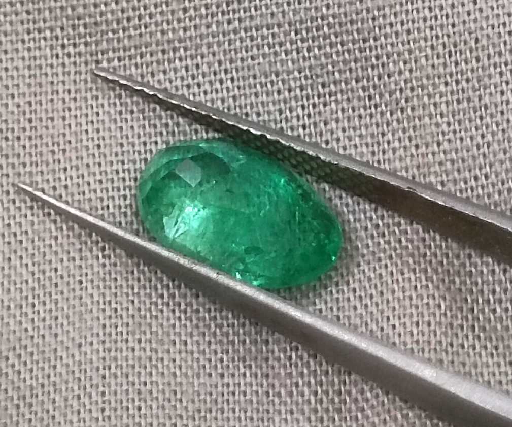 2.57ct GSI certified neon green oval cut Zambian emerald 
