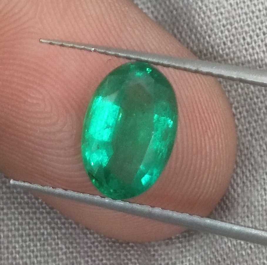 1.96ct GSI certified deep golden green Swat emerald oval cut