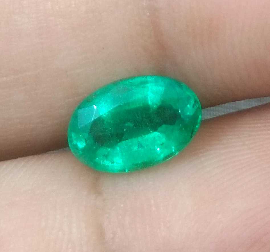 1.96ct GSI certified deep golden green Swat emerald oval cut