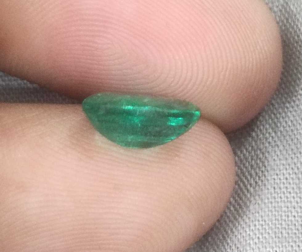1.96ct GSI certified deep golden green Swat emerald oval cut