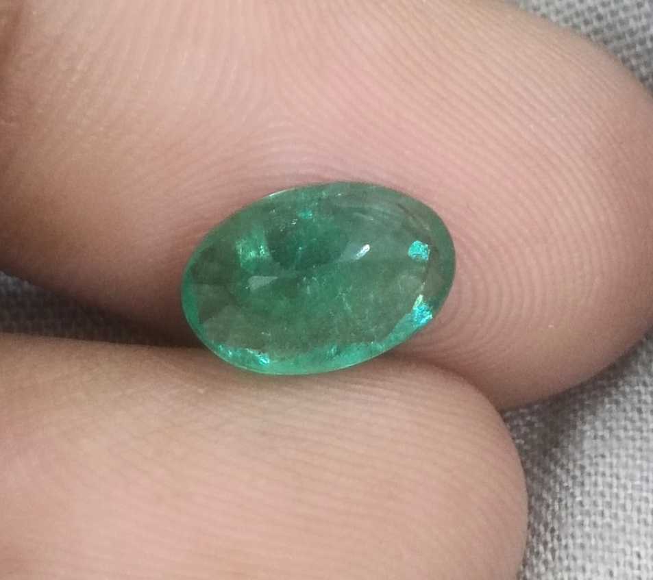 1.96ct GSI certified deep golden green Swat emerald oval cut