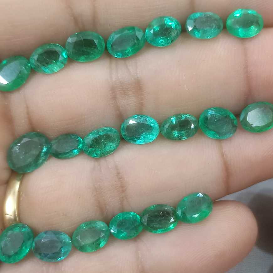 24.31ct oval cut shiny natural loose Zambian emerald wholesale parcel 