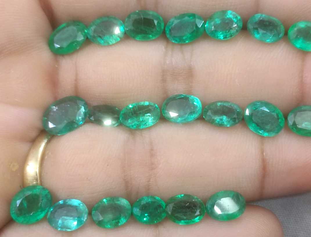 24.31ct oval cut shiny natural loose Zambian emerald wholesale parcel 