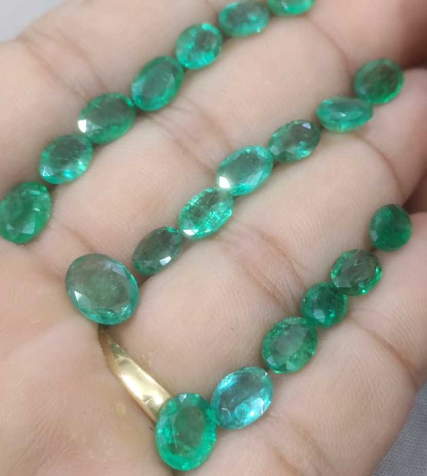 24.31ct oval cut shiny natural loose Zambian emerald wholesale parcel 
