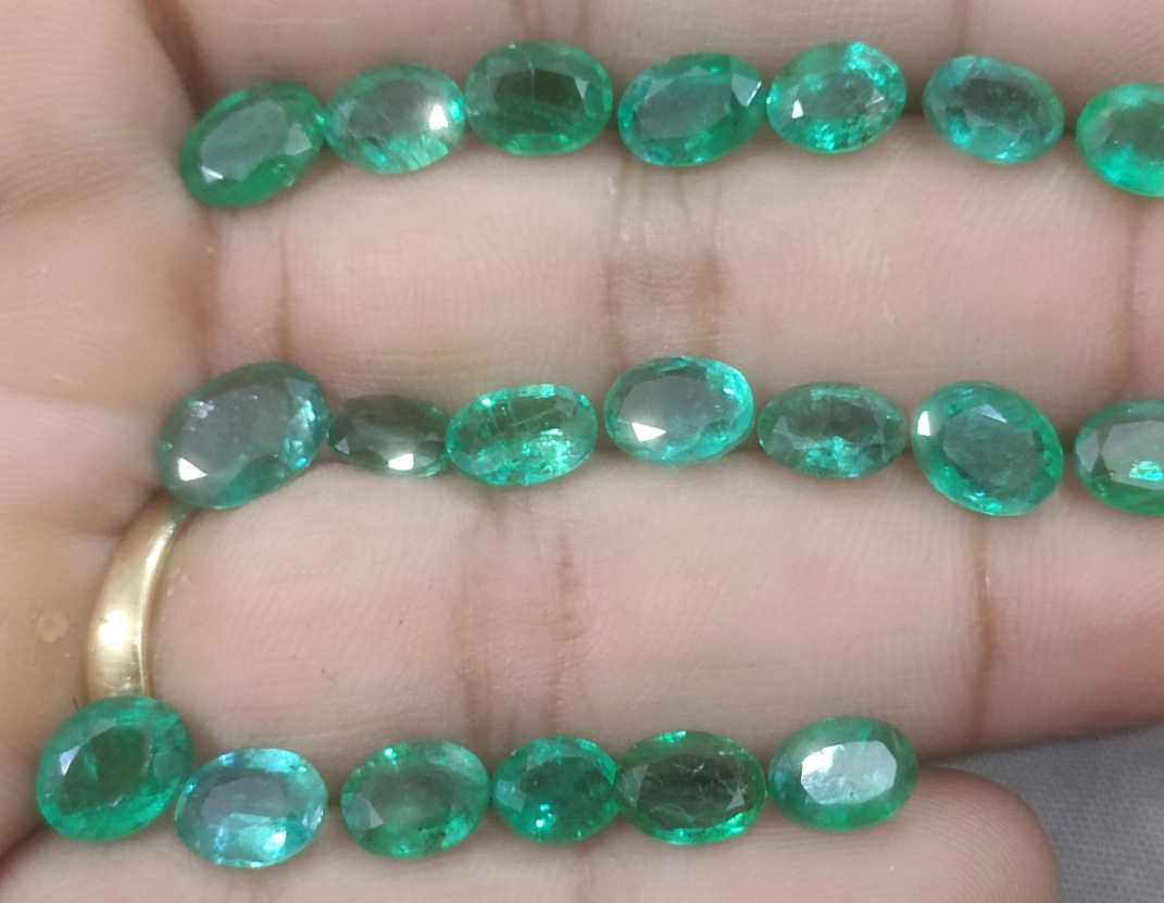 24.31ct oval cut shiny natural loose Zambian emerald wholesale parcel 