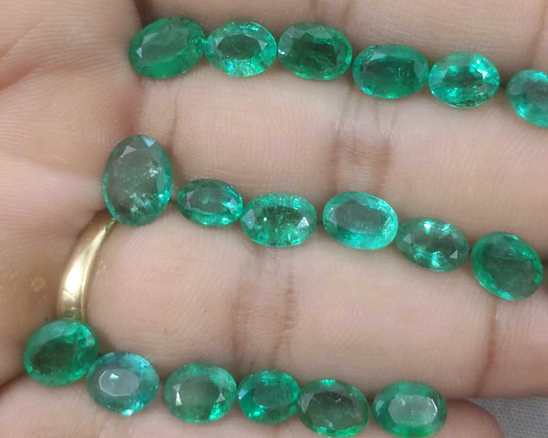 24.31ct oval cut shiny natural loose Zambian emerald wholesale parcel 