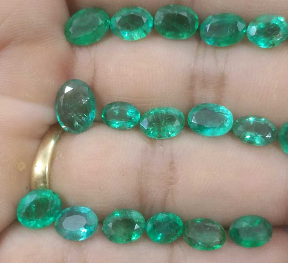 24.31ct oval cut shiny natural loose Zambian emerald wholesale parcel 