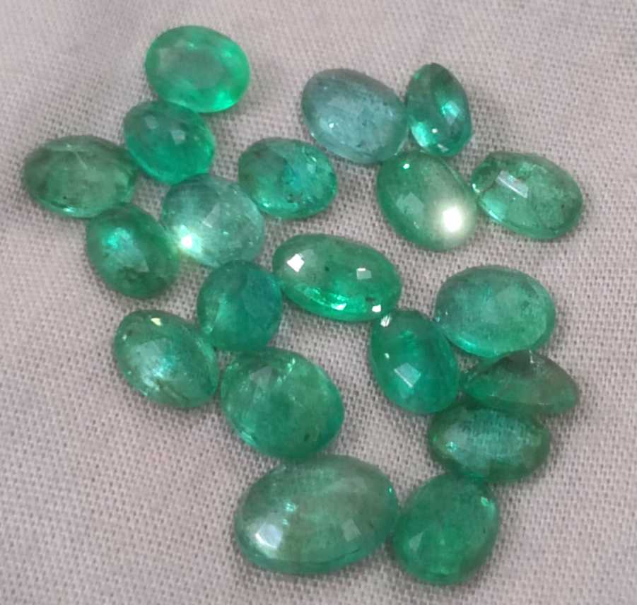 24.31ct oval cut shiny natural loose Zambian emerald wholesale parcel 