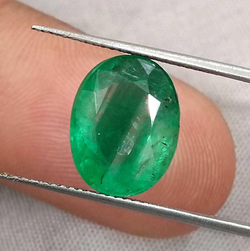 5.72ct Vivid medium green oval cut Swat emerald.
