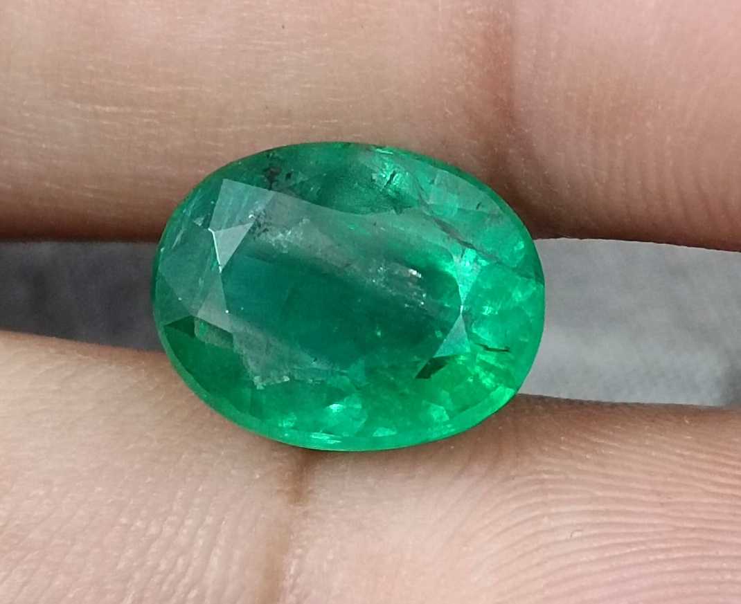5.72ct Vivid medium green oval cut Swat emerald.