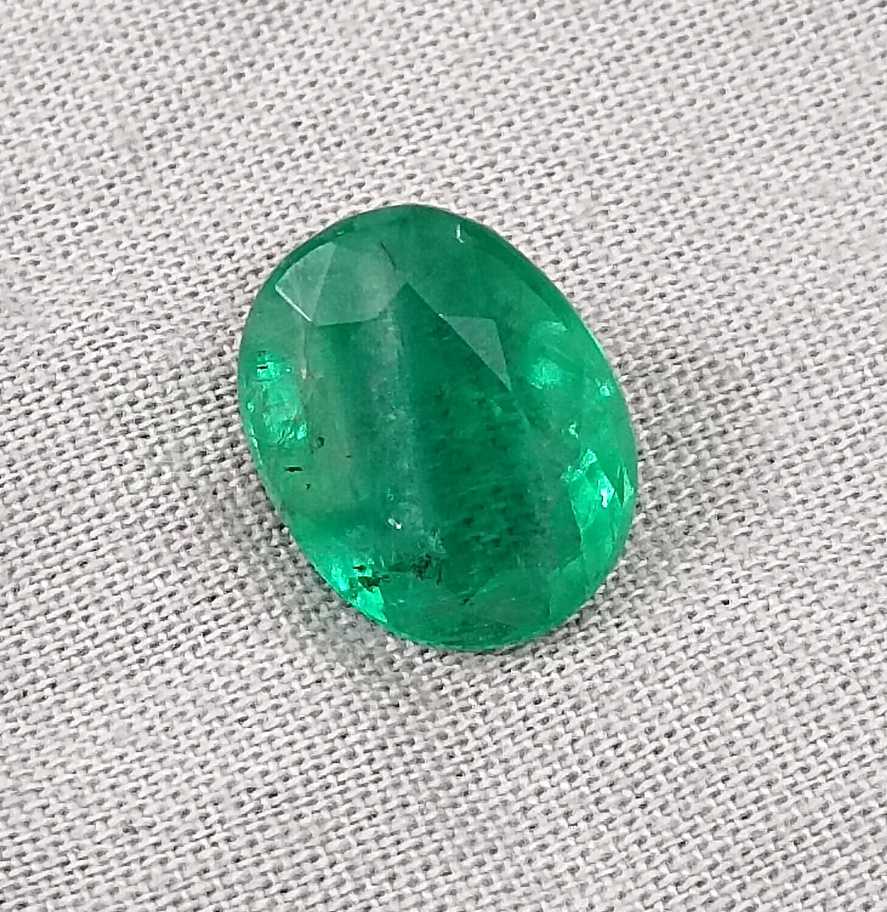 5.72ct Vivid medium green oval cut Swat emerald.