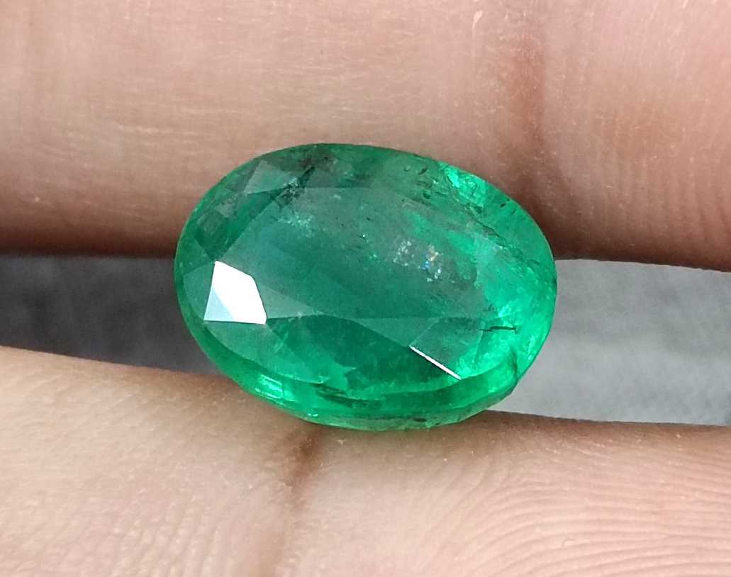 5.72ct Vivid medium green oval cut Swat emerald.