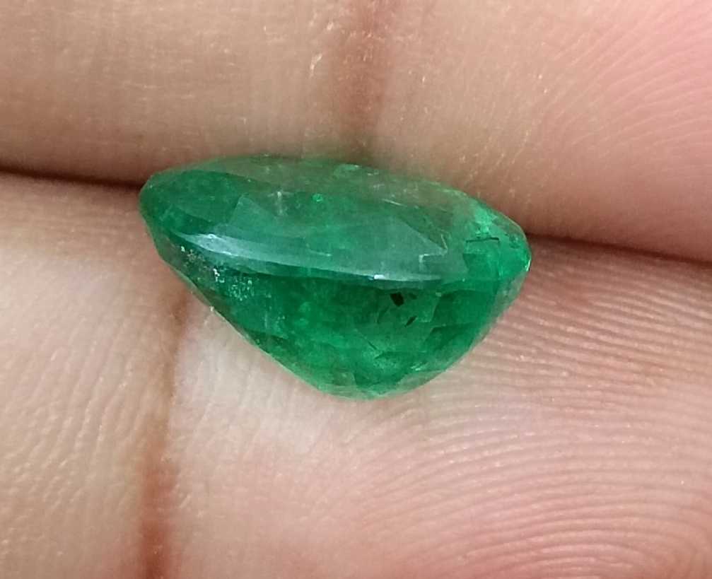 5.72ct Vivid medium green oval cut Swat emerald.