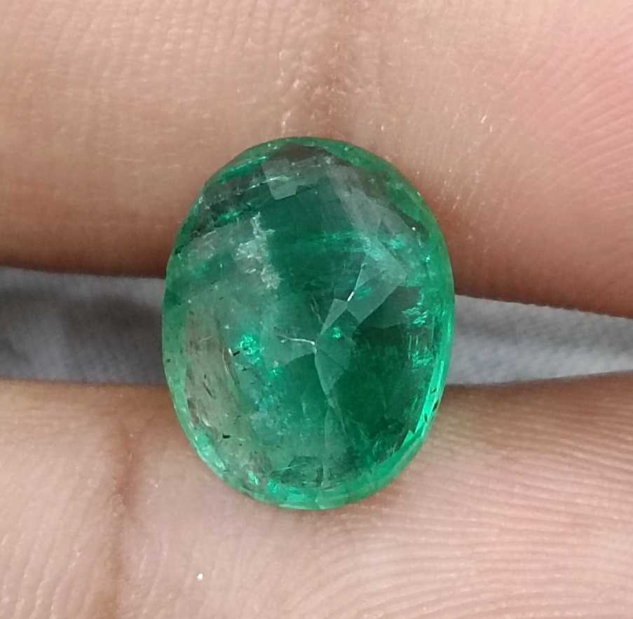 5.72ct Vivid medium green oval cut Swat emerald.