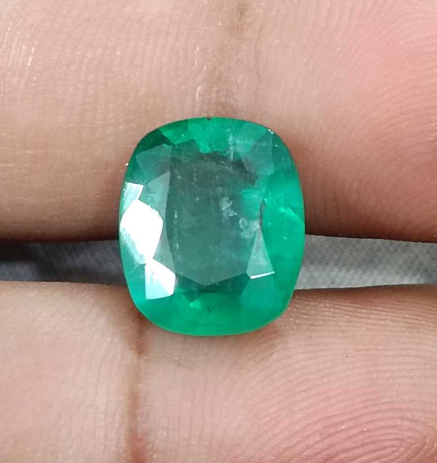 6.28ct Medium deep green cushion cut Zambian emerald.