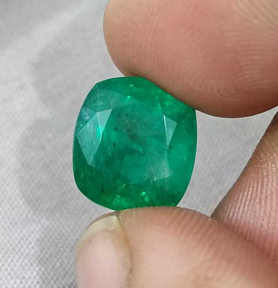 7.30ct Medium Bright green cushion cut Swat emerald.