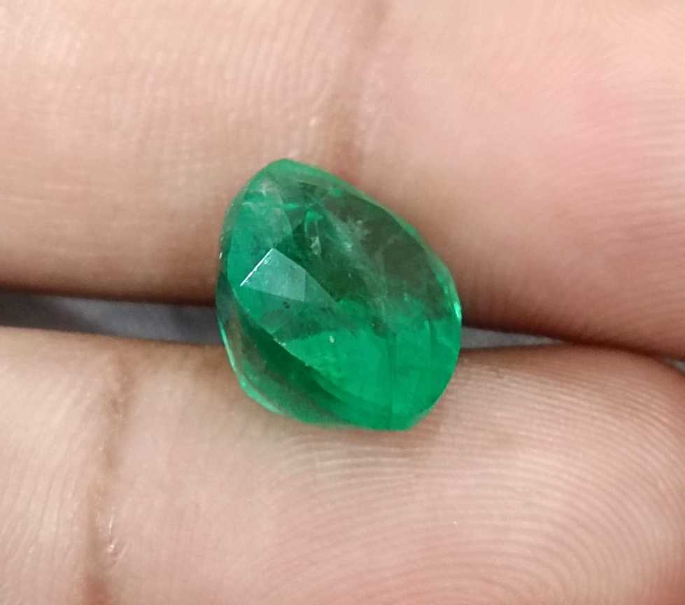 7.30ct Medium Bright green cushion cut Swat emerald.
